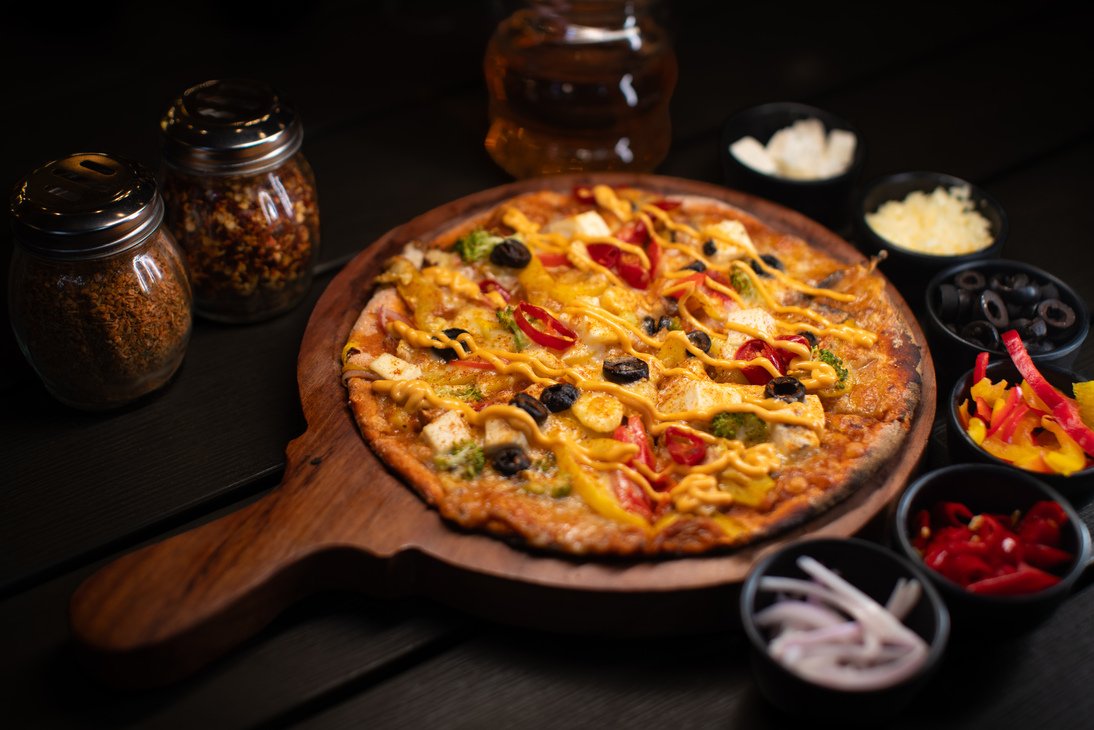 Colourful Bollywood Pizza with paneer and vegetables